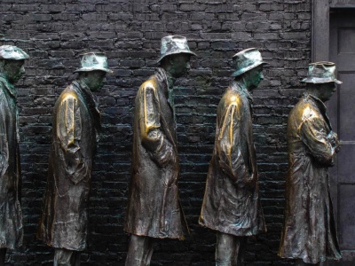 Statue of men waiting in a bread line during the Great Depression