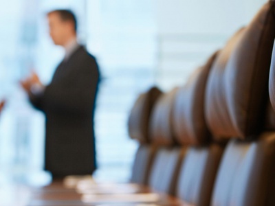 Executives talking in a board room